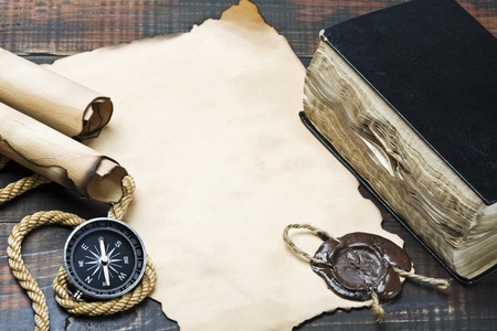 The Bible and compass on old paperの写真素材