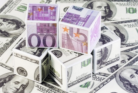 cubes of euros and dollars isolated on the background notesの写真素材