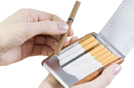 pulling a cigarette from a cigarette caseの写真素材