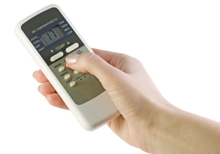 control air-conditioning in the women's hand isolated on whiteの写真素材