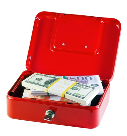 metal box with bundles of money isolated on whiteの写真素材