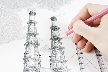 hand with a pencil drawing smokestacksの写真素材