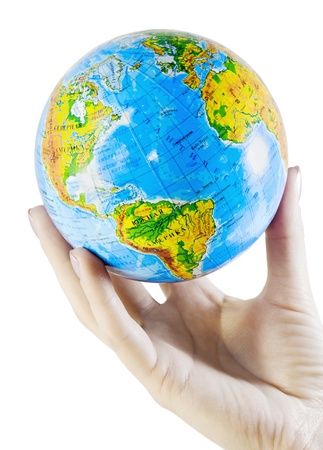 female hand holding a globe isolated on whiteの写真素材