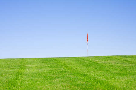 golfball in focus in green fields の写真素材