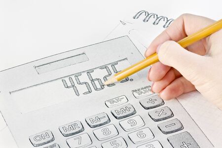 hand with a pencil drawing of business objectsの写真素材