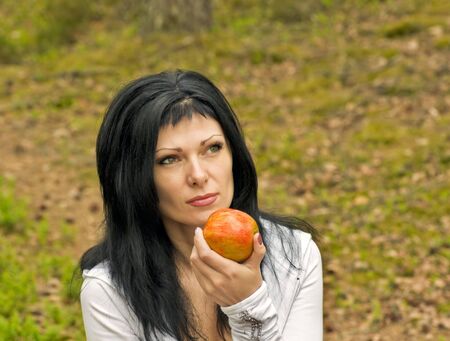 young girl eating an apple ripe for nature
の写真素材