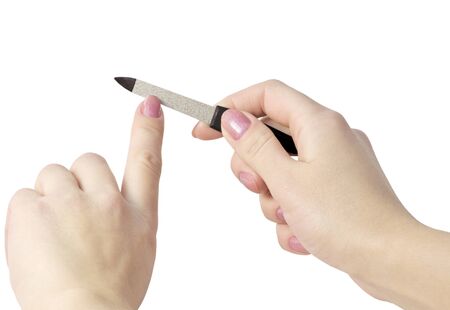 treatment of women's nail manicure isolated on whiteの写真素材