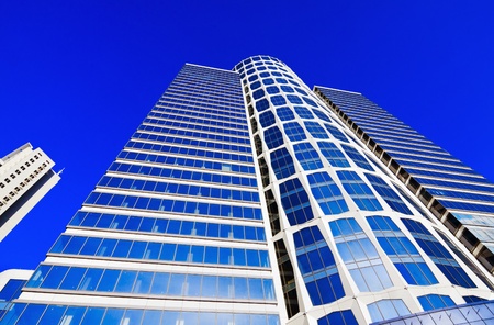 High modern skyscrapers on a background of the blue sky and in solar patches of lightの写真素材