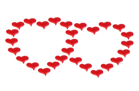 two red hearts made up of little hearts isolated on whiteの写真素材