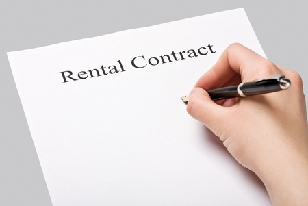 sign a rental contract on a gray backgroundの写真素材