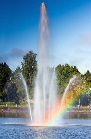 A Reflecting Pool Fountain Creates A Vivid Rainbowの写真素材