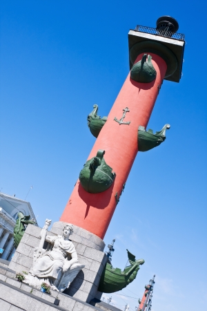 The architecture of Saint-Petersburg, Rostral column on the background of the blue skyの写真素材
