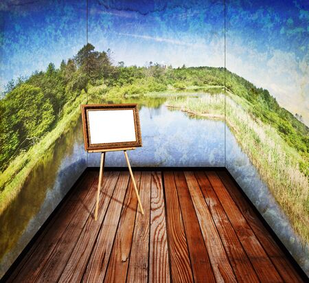 vintage room with a landscape on the walls is an empty easel の写真素材