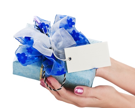 blue gift box with a blank space for greetings in the hands isolated on white backgroundの写真素材
