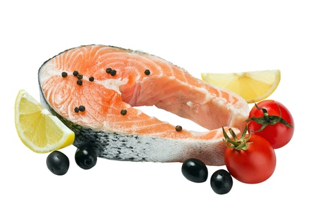 salmon steak with vegetables isolated on white background の写真素材