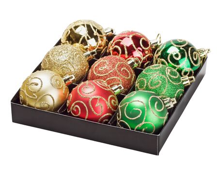 Multicolored Christmas balls in a box isolated on white backgroundの写真素材