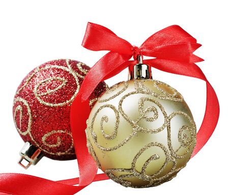 Christmas ball with red bow and ribbon isolated on a white background の写真素材