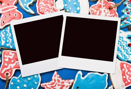 photo frames on the background of Christmas gingerbread homemadeの写真素材