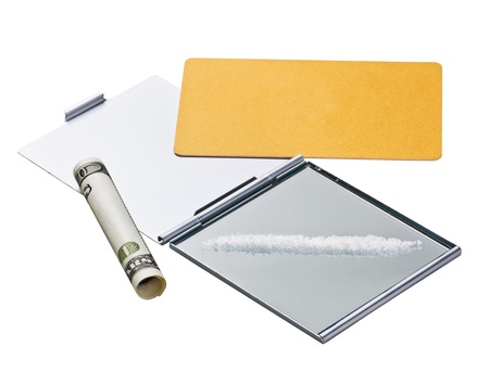 Cocaine (fake) lines on mirror with a credit card and rolled billの写真素材