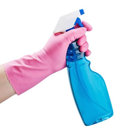 gloved hand holding a spray bottle isolated on white backgroundの写真素材