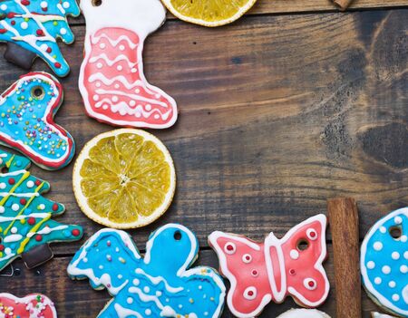 Curly Christmas gingerbread home cooking on a wooden table の写真素材