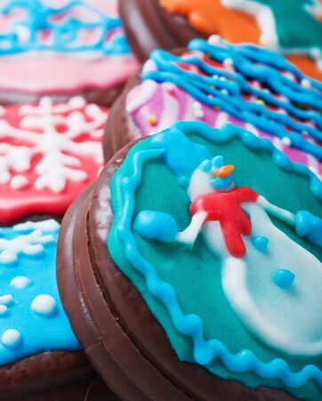 Christmas cakes with chocolate and covered with colored icingの写真素材