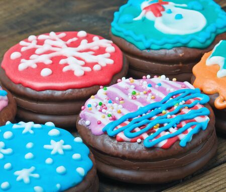 Christmas gingerbread coated with chocolate icing and colorfulの写真素材