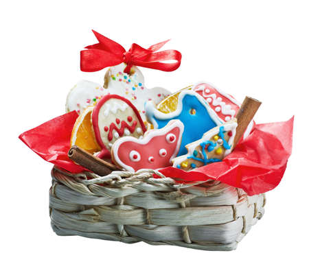 Christmas gingerbread cookies in a basket isolated on white backgroundの写真素材