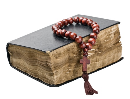 Bible and rosary isolated on white background の写真素材