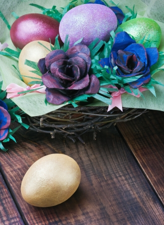 Colorful easter eggs and rose from the egg packaging の写真素材