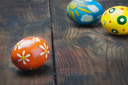colorful painted Easter eggs on wooden tableの写真素材
