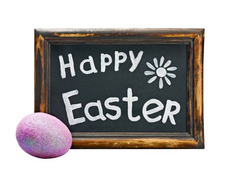 Easter egg and Easter greetings on a blackboard isolated on white backgroundの写真素材
