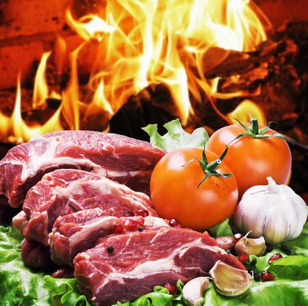 fresh pieces of steak and vegetables for grillingの写真素材