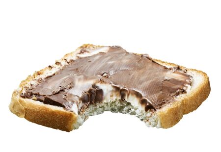 bitten slice of chocolate sandwich isolated on white background の写真素材