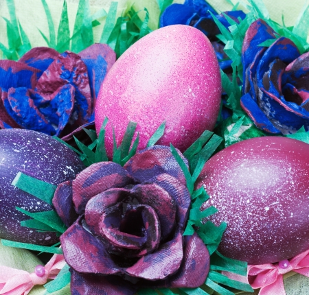 Colorful easter eggs and rose from the egg packagingの写真素材