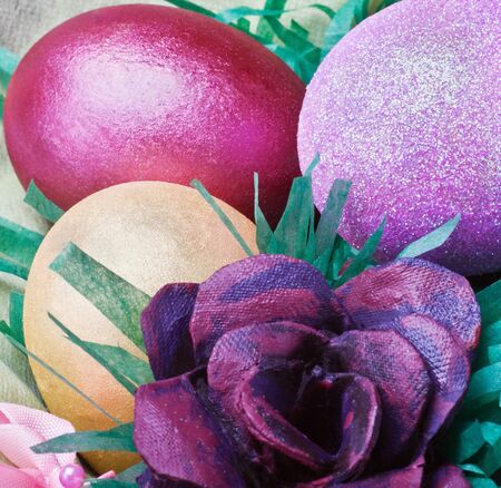 Colorful easter eggs and rose from the egg packagingの写真素材