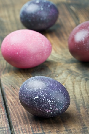 painted Easter eggs on wooden tableの写真素材