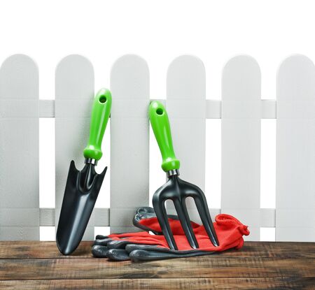garden tools and gloves isolated on white backgroundの写真素材
