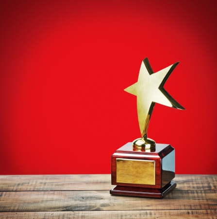star award with space for text on a red backgroundの写真素材
