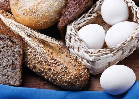 assortment of baked bread on wood table  の写真素材