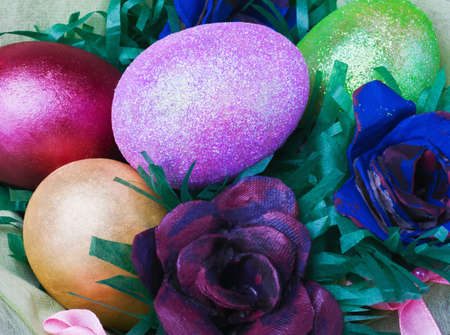 Colorful easter eggs and rose from the egg packaging の写真素材