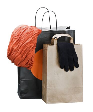color shopping bags with clothing isolated on whiteの写真素材