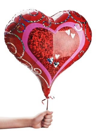 red balloon in hand isolated on white backgroundの写真素材
