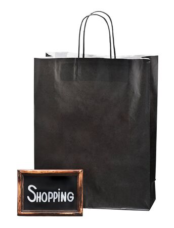 blackboard with the words and paper shopping bag on white backgroundの写真素材
