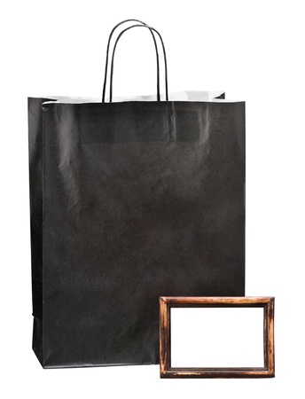 paper bag for shopping and photoframe with space for text on white backgroundの写真素材