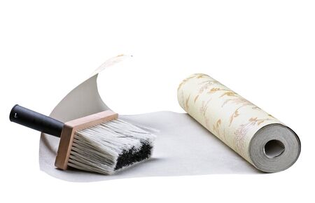 wallpaper and brush sticking isolated on white backgroundの写真素材