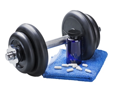 dumbbell and pills isolated on white backgroundの写真素材