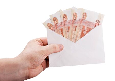 hand holding an envelope with rubles isolated on white backgroundの写真素材