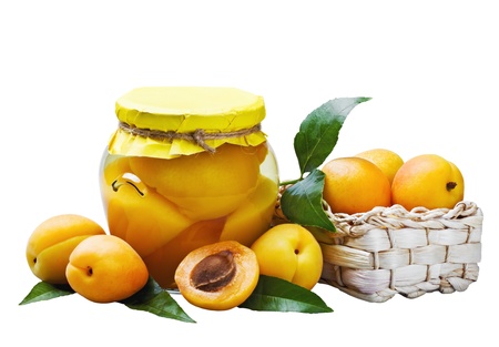 fresh and canned apricots isolated on white backgroundの写真素材