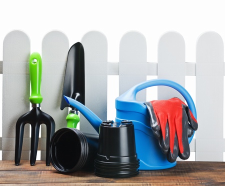 gardening tools with space for text on the background of the fenceの写真素材